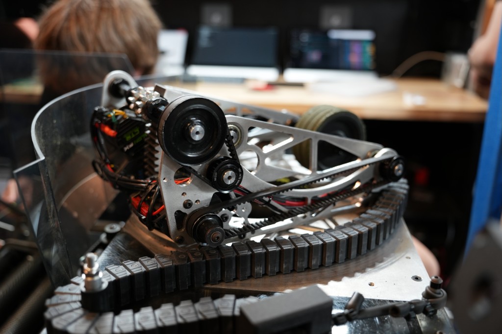 Close-up of the shooter mechanism showing belt and pulley assembly